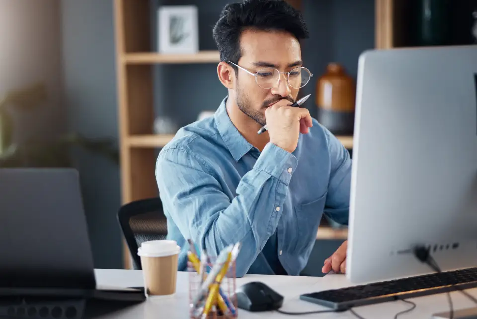 Man working intently at desk
